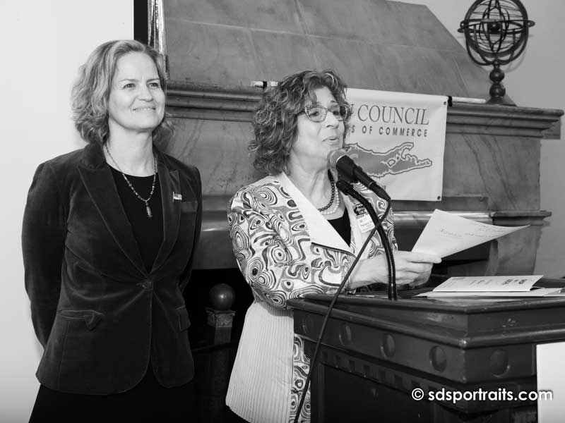 women speaking at podium